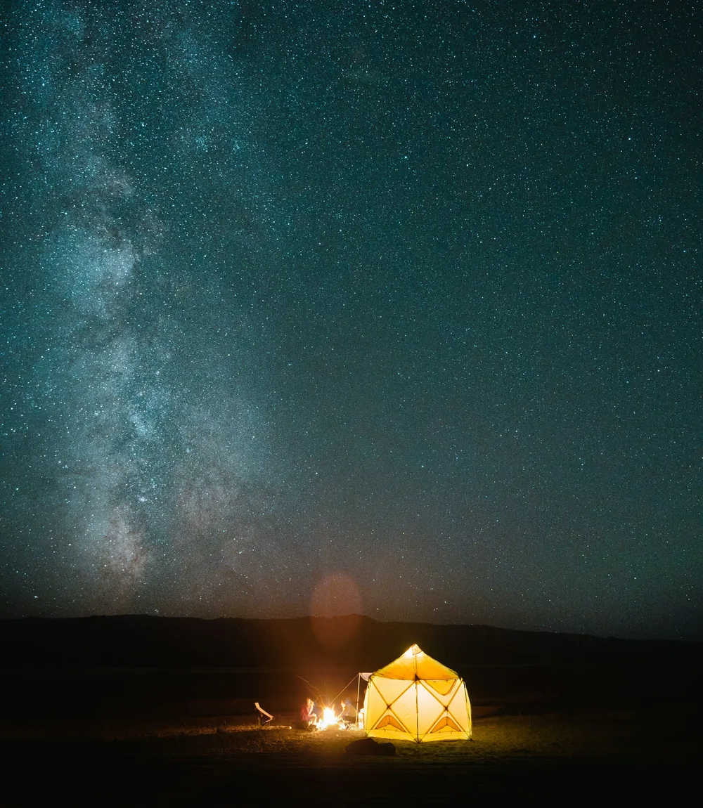 A desert camp under a starry night sky in Wadi Rum